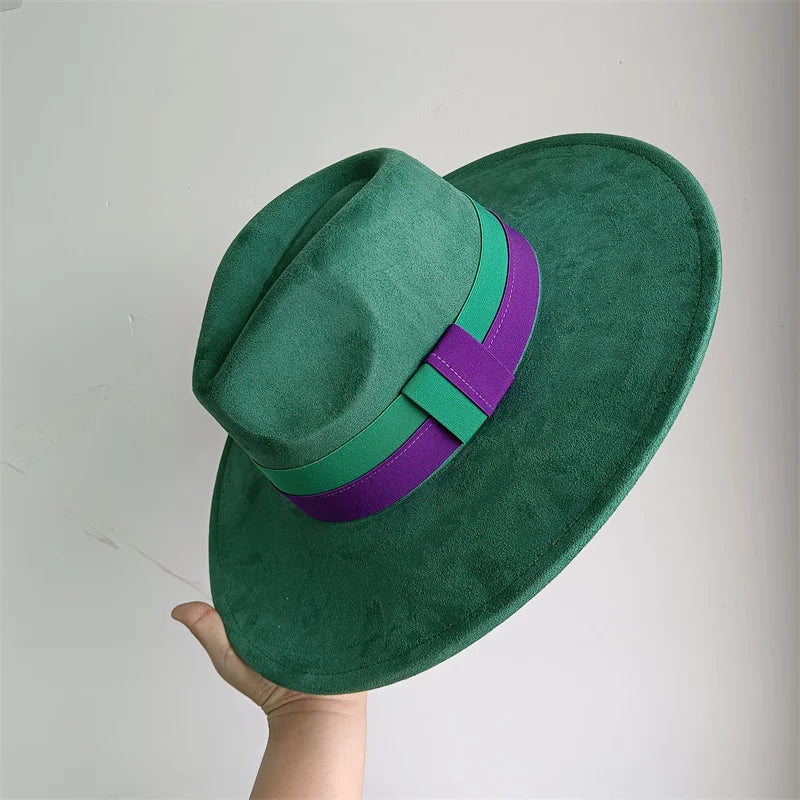 Green fedora hat with a purple band held against a light gray background