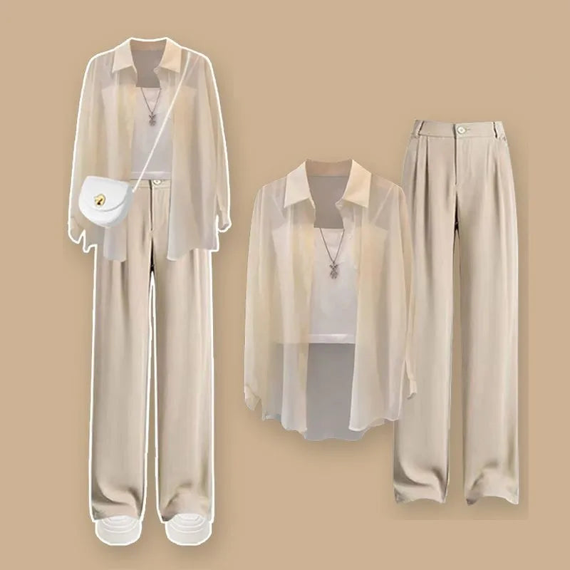 Set of beige and white clothing items including a shirt, pants, and a bag on a beige background. Women’s 3-piece French style set: chiffon cardigan, sling shirt, high-waist wide leg pants. Chic, lightweight and sun-protective fashion for spring/summer.