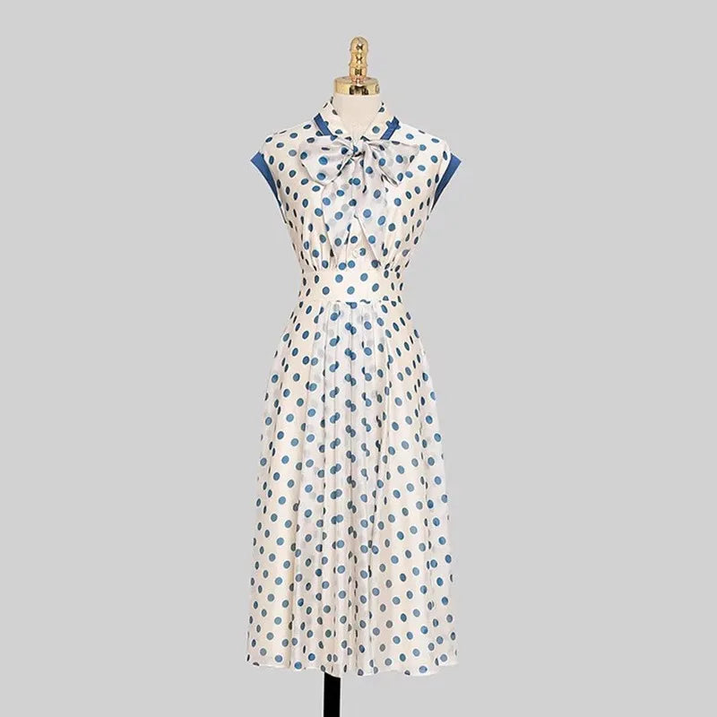 Discover timeless elegance with our Hepburn Vintage Polka Dot Print Bowknot Summer Dress. This mid-calf A-line dress features a charming polka dot pattern, a flattering slim waist, a turn-down collar, sleeveless design, and a decorative bow. Perfect for women aged 25-35 for spring and summer parties. Shop now for classic fashion with a modern twist!