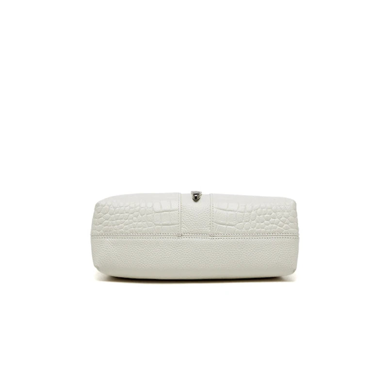 White textured clutch bag on a white background. Genuine leather women’s shoulder messenger bag in black and gray. Soft cow leather, flap style with zipper closure. Perfect versatile bag for all seasons.