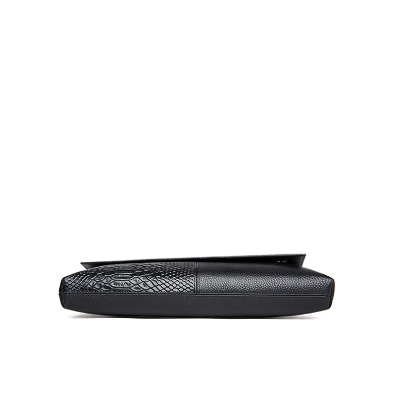 Black leather clutch bag with textured pattern on a white background