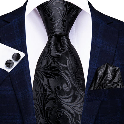 Black paisley tie with matching pocket square and cufflinks on a navy blazer. Men’s luxury paisley silk tie and pocket square set, 8.5cm wide, for business or wedding. Red formal necktie, ftf fashion UK.