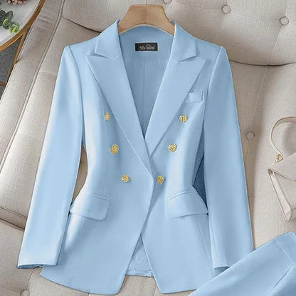 Light blue suit jacket with gold buttons on a beige sofa