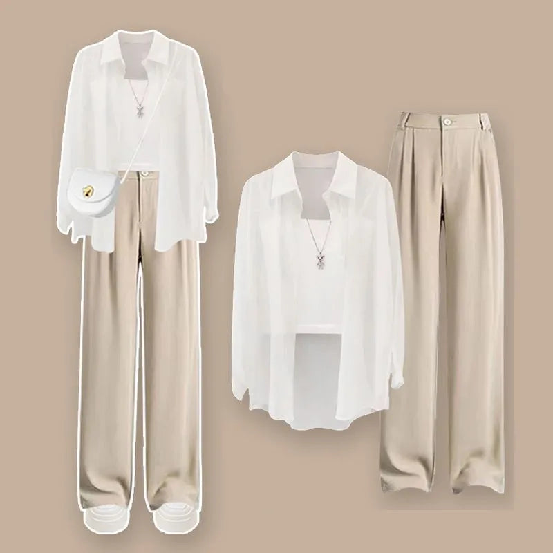 White blouse and beige pants displayed against a beige background. Women’s 3-piece French style set: chiffon cardigan, sling shirt, high-waist wide leg pants. Chic, lightweight and sun-protective fashion for spring/summer.