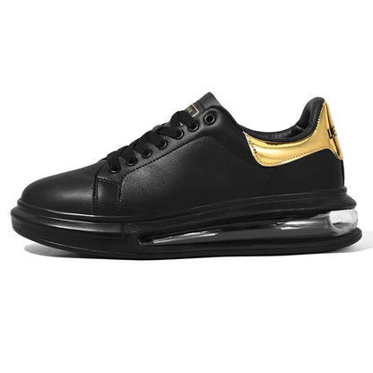 Black sneaker with gold accents on a white background