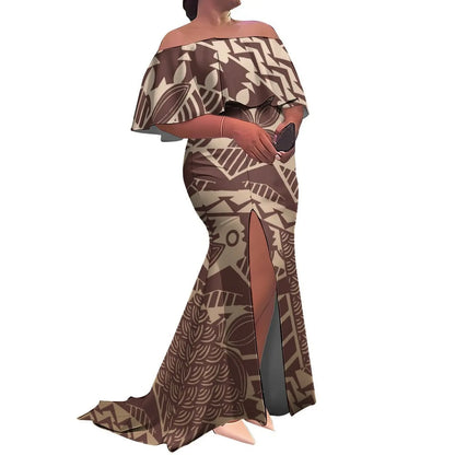 Woman wearing a brown and beige patterned off-shoulder dress with a slit on a white background