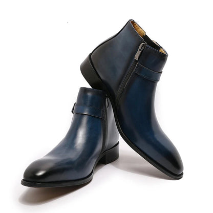 Pair of navy blue leather boots with a zipper on a white background