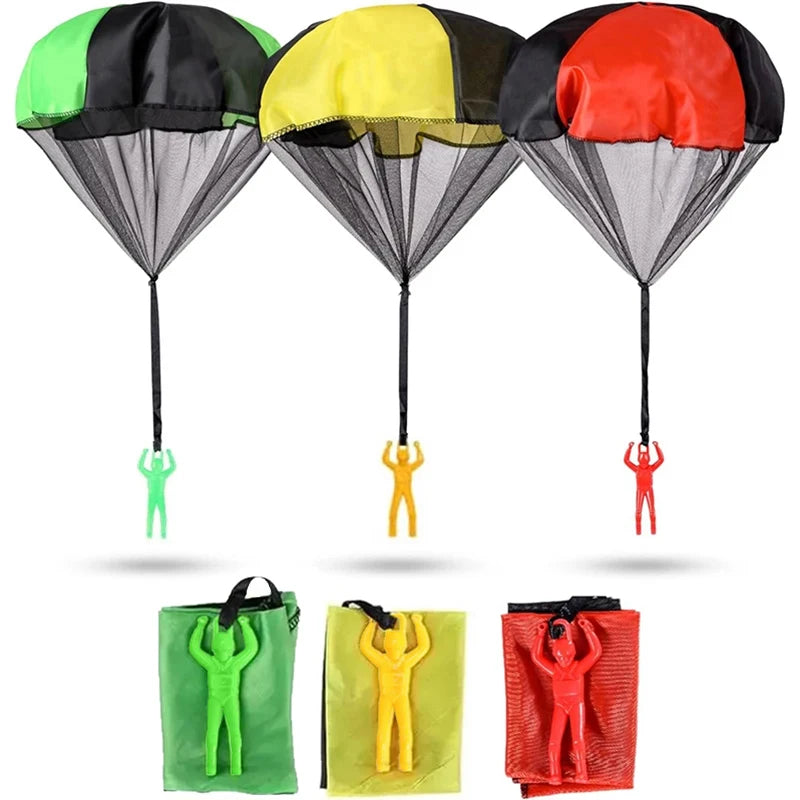Three colorful paragliding parachutes with corresponding landing bags on a white background. Colorful outdoor parachute toy for kids, tangle-free design. Durable plastic, unisex gift idea for boys and girls. UK delivery ftf fashion.