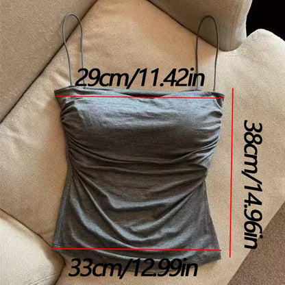 Gray strapless top with measurements on a beige couch. Corset taille cintrée élégant, sans manches avec pliage, coussinet poitrine, bretelles fines, top court solide, mode UK FTF Market.