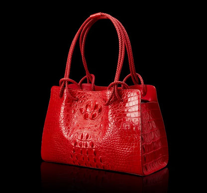 Red crocodile-patterned handbag on a black background. Luxury women’s tote bag in genuine red crocodile leather. Large capacity, stylish handle, fashion travel handbag. Perfect for shoulder or portable use UK.