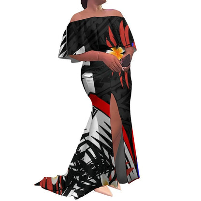 Woman wearing a black and white patterned dress with a red accent on a white background