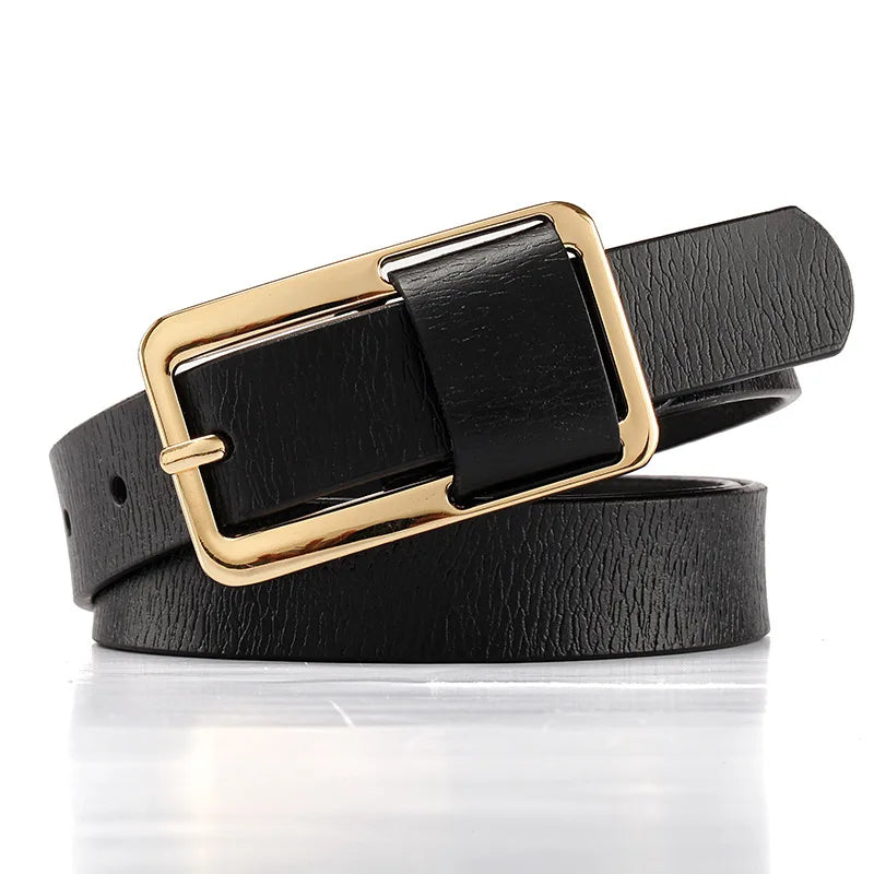 Black leather belt with a gold buckle on a white background. Women’s wide leather belt with cinched design and metal buckle. Enhances waistline for shirts, dresses, suits. Trendy, durable, UK fashion accessory.