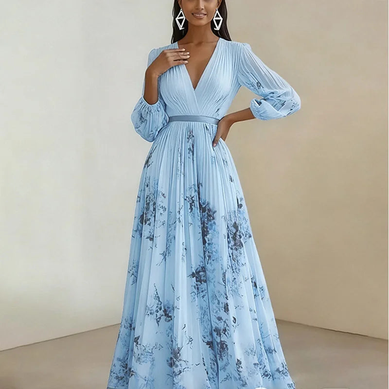 Woman wearing a light blue floral dress against a beige background