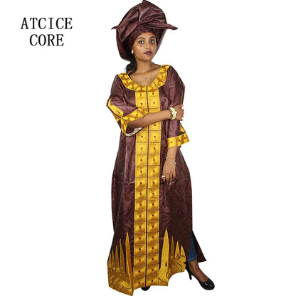 Woman wearing a brown and gold traditional outfit with matching headwrap on a white background.