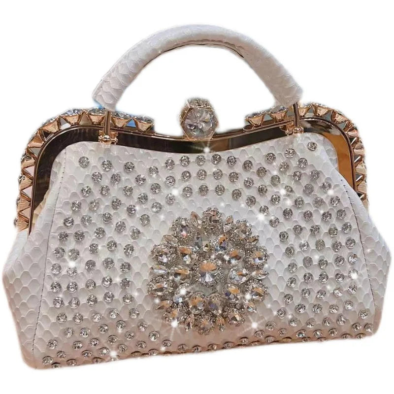 Elegant handbag with crystal embellishments on a white background. Large genuine leather dumpling bag with diamond rhinestone clip and lock clasp. Soft handle, multiple compartments. Fashionable shoulder tote for women.
