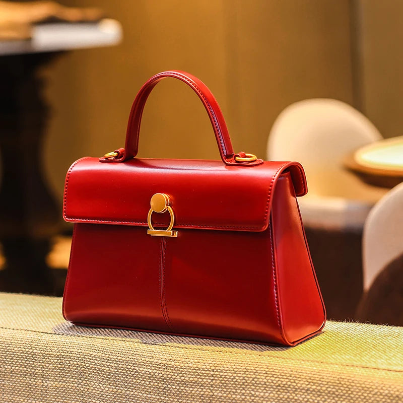 Red handbag with gold accents on a textured surface. Small square crossbody bag in soft microfiber synthetic leather with sequined flap. Interior zipper pocket. Versatile vintage style. Fast UK shipping.