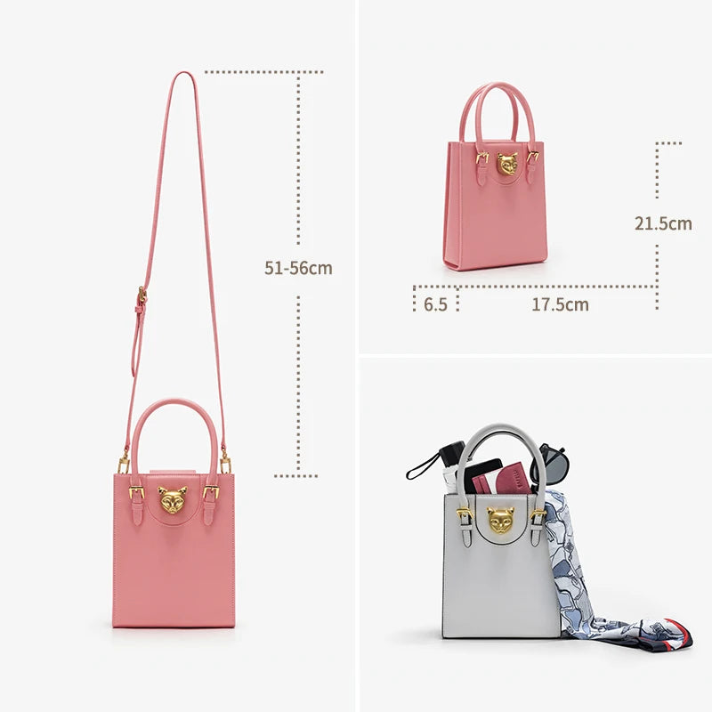 Pink handbag with measurements on a white background. Unisex mini tote crossbody bag in split leather with flap pocket and lock closure. Hard box shape and polyester lining. Casual versatile style.