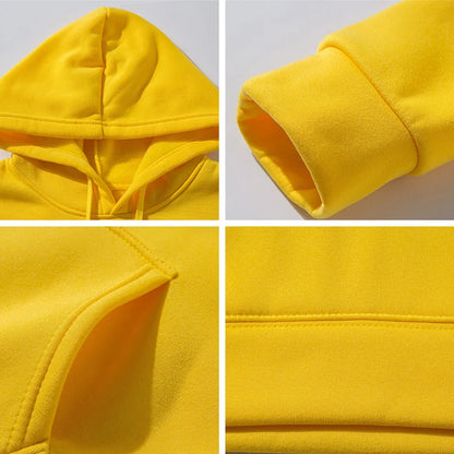 Close-up details of a yellow hoodie on a gray background