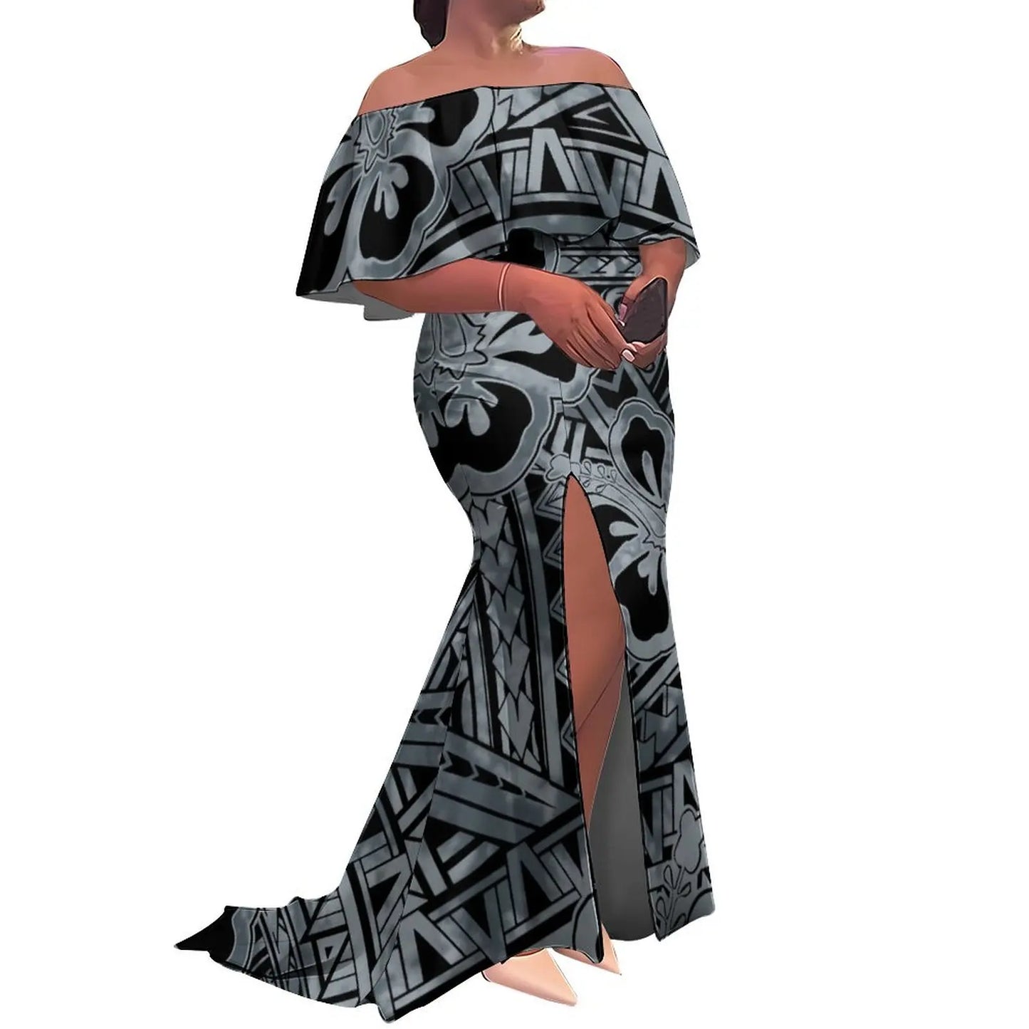 Woman wearing a black and gray patterned off-shoulder dress with a slit on a white background