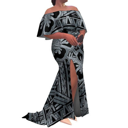 Woman wearing a black and gray patterned off-shoulder dress with a slit on a white background