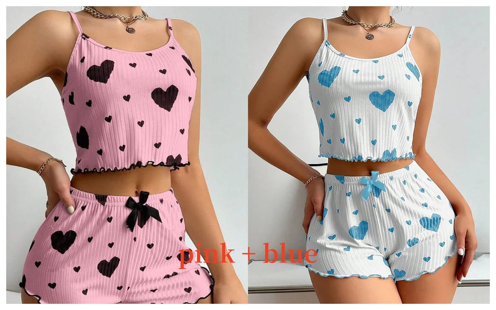 Two women wearing matching outfits with pink and blue heart patterns. Soft women’s pajama set, 2 pieces white tank top and shorts, breathable fabric with love print, comfortable casual sleepwear, UK FTF Market.