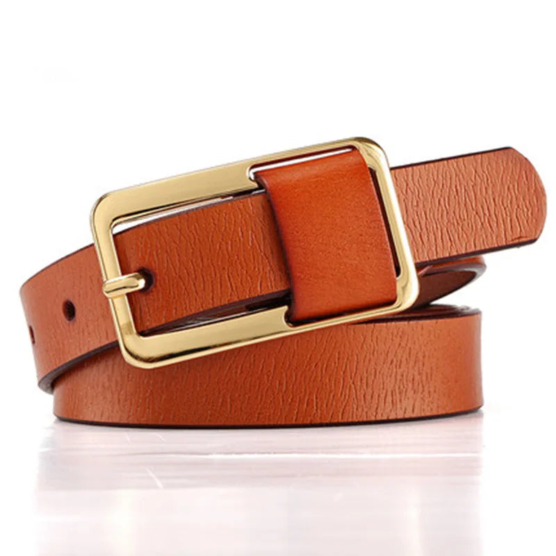 Brown leather belt with a gold buckle on a white background. Women’s wide leather belt with cinched design and metal buckle. Enhances waistline for shirts, dresses, suits. Trendy, durable, UK fashion accessory.