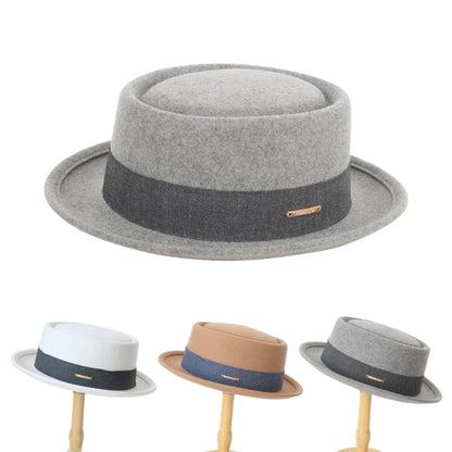 Set of gray, white, brown, and beige fedoras on stands against a white background. Fedora hat polyester unisex carnival mask, gentleman style, costume accessory, roll trim hat for party and carnival events.