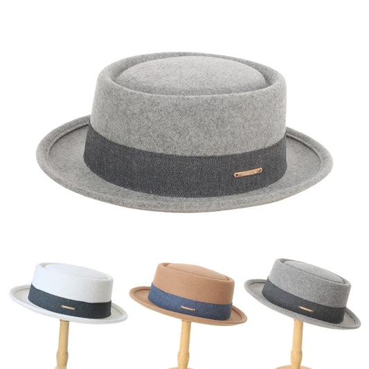 Set of gray, white, brown, and beige fedoras on stands against a white background. Fedora hat polyester unisex carnival mask, gentleman style, costume accessory, roll trim hat for party and carnival events.