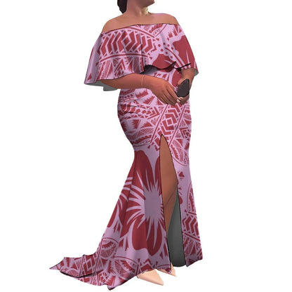 Woman wearing a pink and white patterned off-shoulder dress with a high slit on a white background