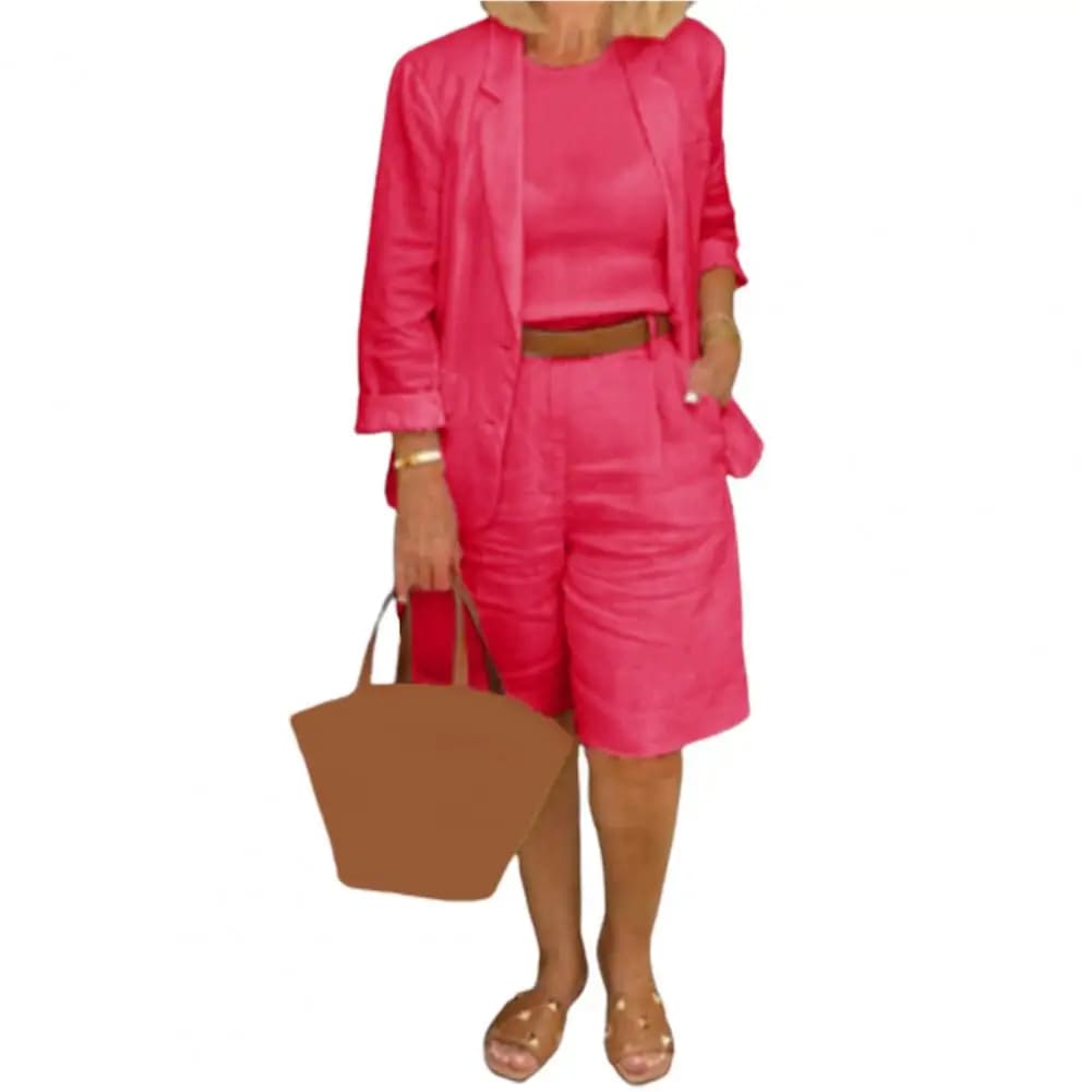 Image of a woman wearing a white Linen Look Blazer and Bermuda Shorts Co-ord Set with a brown belt and straw bag. Ideal smart casual summer outfit.