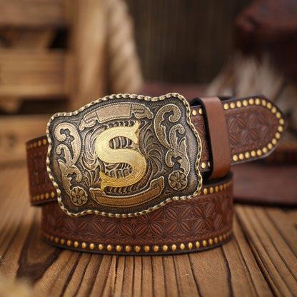 Brown leather belt with gold buckle on a wooden surface
