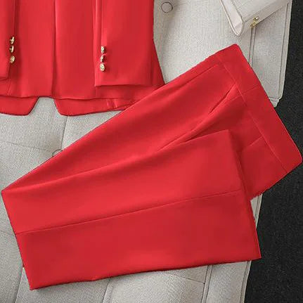 Red  pants on a light gray surface with a blurred background