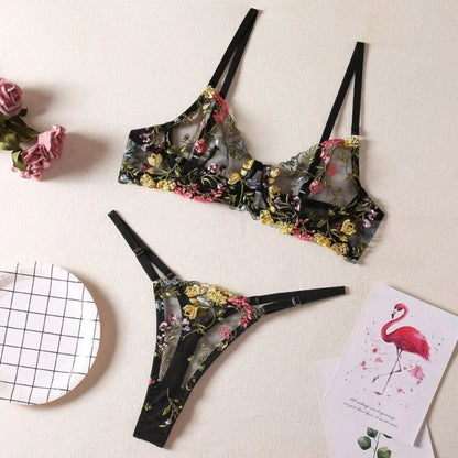 Floral lingerie set with pink flamingo cards on a light background