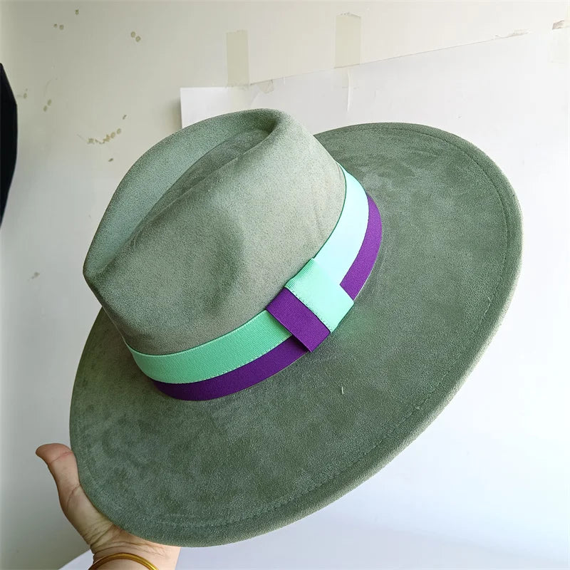 Green wide-brimmed hat with colorful bands held against a light background