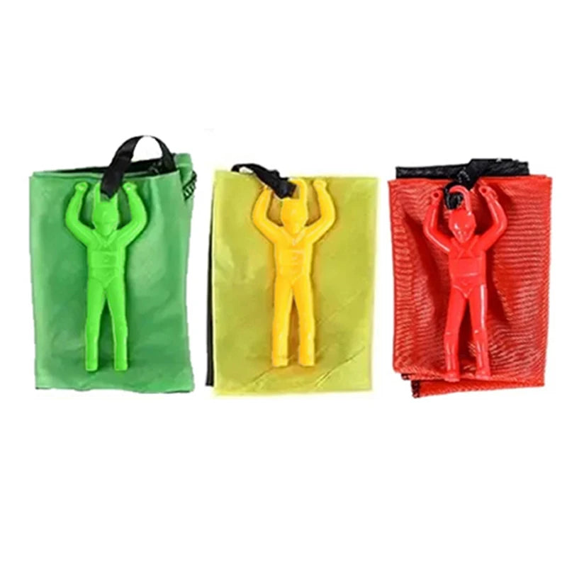 Three colorful resistance bands with figures on a white background. Colorful outdoor parachute toy for kids, tangle-free design. Durable plastic, unisex gift idea for boys and girls. UK delivery ftf fashion.