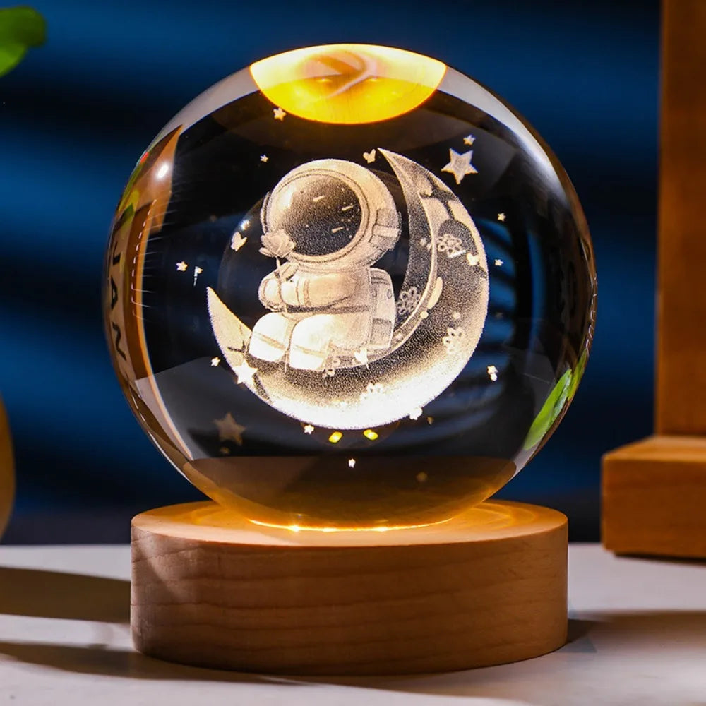 A 3D Axolotl laser engraved inside a crystal ball with a LED base, projecting colors to create a vibrant appearance. 3D laser engraved axolotl crystal ball lamp with USB LED base, vibrant colours UK.