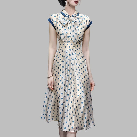 Discover timeless elegance with our Hepburn Vintage Polka Dot Print Bowknot Summer Dress. This mid-calf A-line dress features a charming polka dot pattern, a flattering slim waist, a turn-down collar, sleeveless design, and a decorative bow. Perfect for women aged 25-35 for spring and summer parties. Shop now for classic fashion with a modern twist!