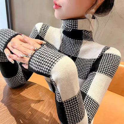 Person wearing a black and white checkered outfit with a blurred background