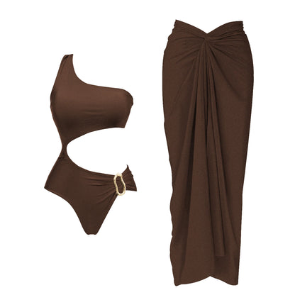 Brown one-shoulder swimsuit with a matching sarong on a white background. Women’s 2-piece deep V swimsuit with long skirt, adjustable straps, solid color, beachwear, comfortable polyester/spandex fabric, flattering fit.