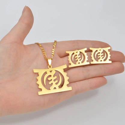African Gye Stool gold pendant necklace and stud earrings set product detail on neutral background