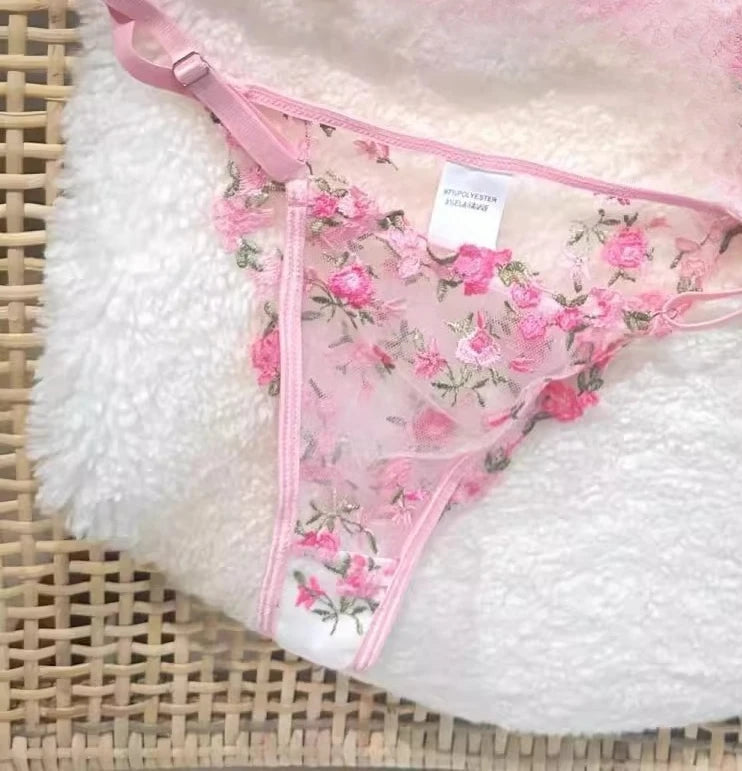 Floral lingerie set on a textured surface