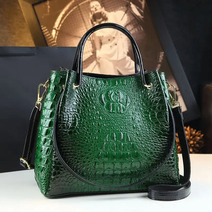 Green textured handbag with black handle and strap on a white surface. Vintage genuine leather bucket tote bag with crocodile print. Soft medium-hardness leather, zipper closure, interior pockets. Stylish crossbody bag UK.