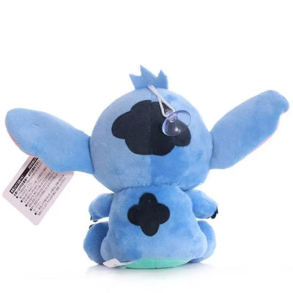 Blue plush toy with black accents on a white background