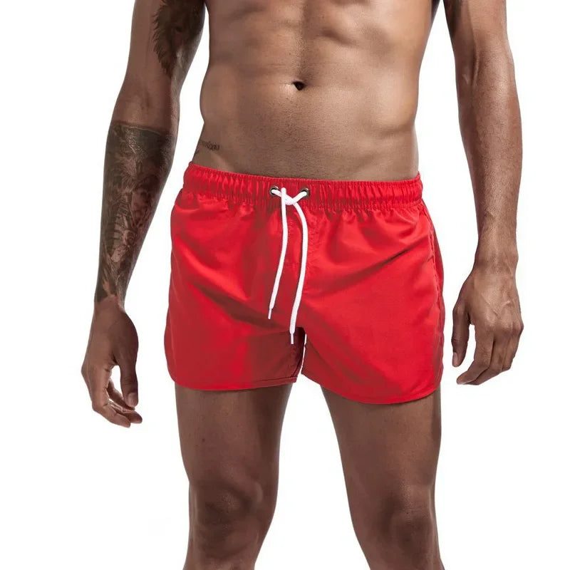 Men's red quick-drying swimming trunks in vibrant colors for beach and surfing