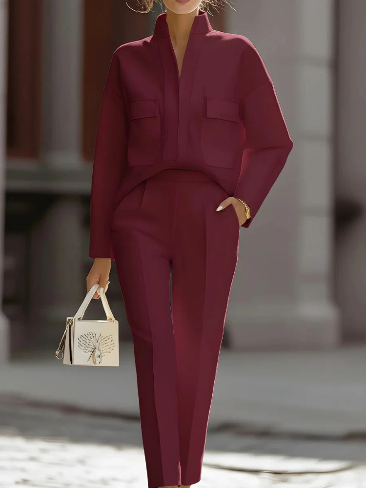 Person wearing a burgundy outfit with a blurred background