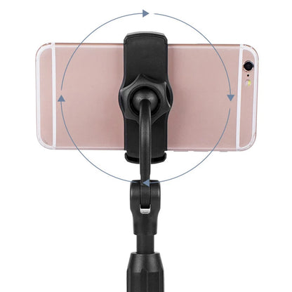 Phone holder with a smartphone on a white background. Aluminum alloy desktop tripod phone holder stand bracket for iPhone & smartphones. Portable stable tripod perfect for photography, video, live calls.