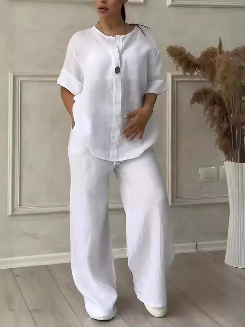 Women's casual co-ord set in white — cotton linen V-neck blouse and wide leg trousers...