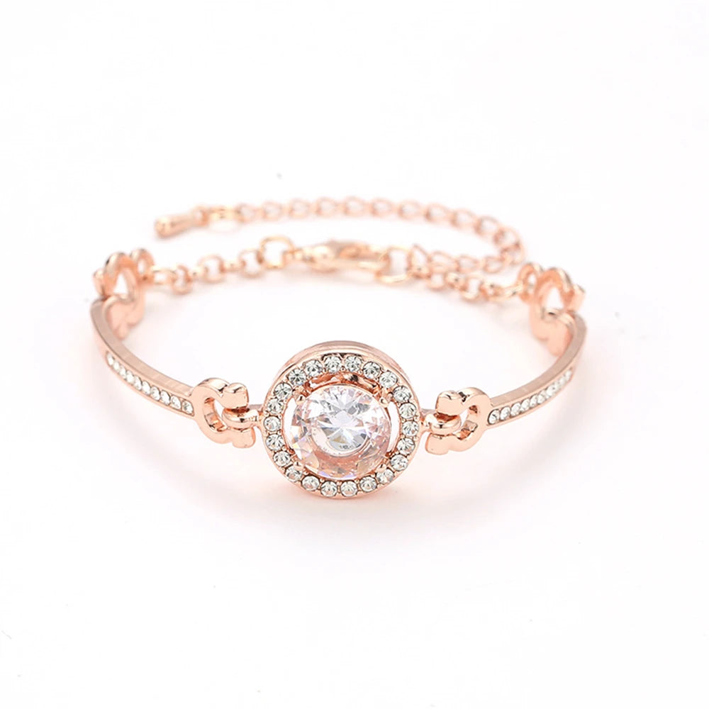 Rose gold bangle bracelet encrusted with clear crystals