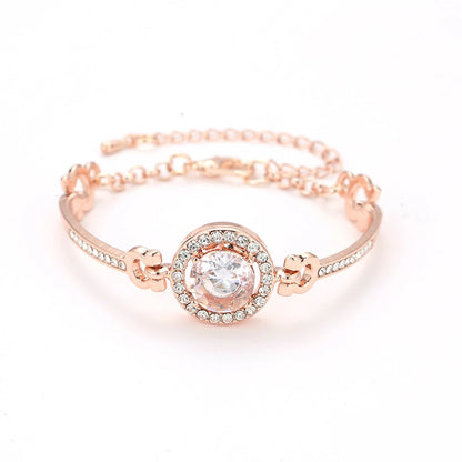 Rose gold bangle bracelet encrusted with clear crystals