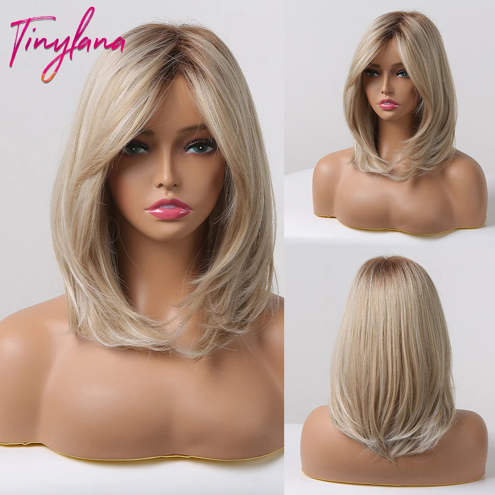 Layered long bob wig in cool ash blonde ombre with deep roots and curtain bangs.